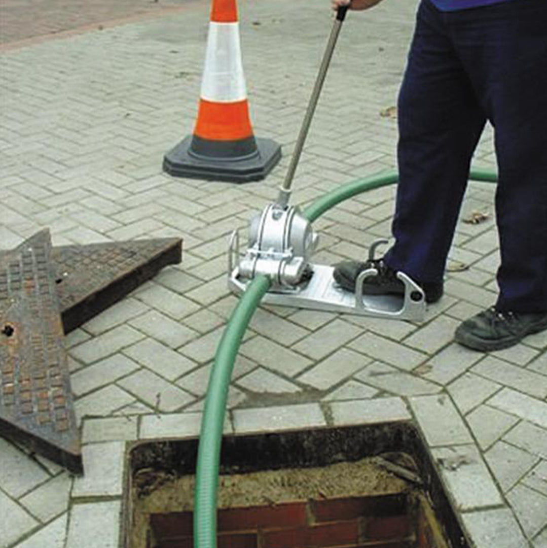 DD Hand Diaphragm Water Pump- location shot, pump being used in man hole