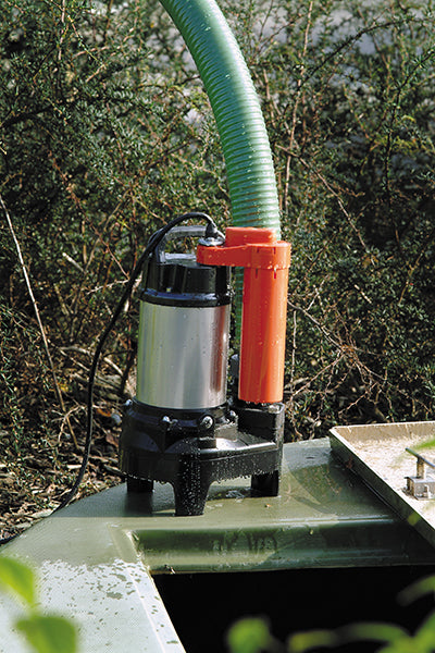 POMA Submersible Drainage Water Pump - location shot, pump extracting water through attachable hose