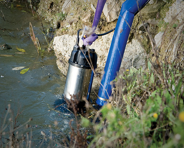 HD-15 Contractor's Sump Pump - location shot, pump placed in river water with hose attached